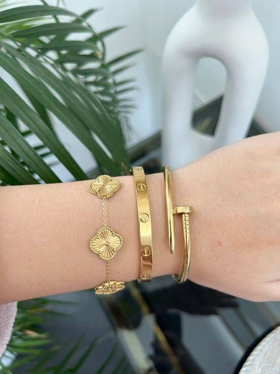 Stainless Steel Cartier, Nail and Gold Van Cleef Set